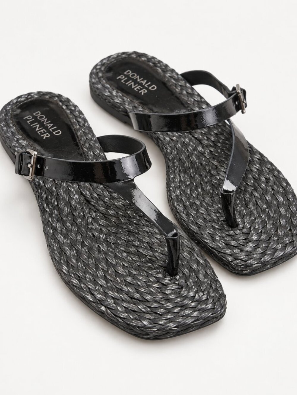 Donald Pliner black flat sandals with glossy patent-style straps
